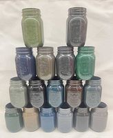 Full pyramid view of 17 painted Bernardin Mason jars