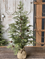 Assembled tree showing foliage, pine cones and burlap base