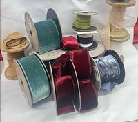 Group of assorted ribbon spools showing colors and widths
