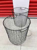 both black wire baskets side by side