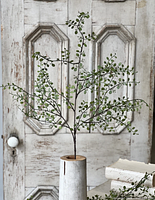 Single artificial branch displayed upright