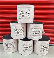 Front view of stacked six white holiday buckets