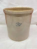 Full exterior view showing beige salt-glazed body, blue crown 5 mark