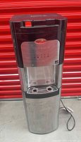 Front view of Whirlpool stainless and black water cooler