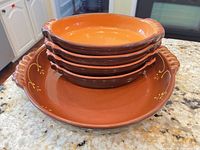 Stack showing large dish and five smaller dishes