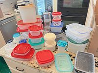 Group shot of all plastic containers and lids on countertop