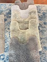 Stacked view of contour mat and rug showing pile height and color