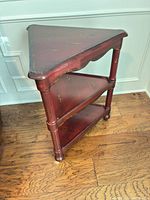 Full view of triangular three-tier corner shelf