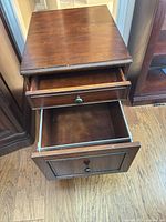 Nightstand top open drawers view