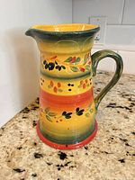 Full view of hand-painted ceramic pitcher