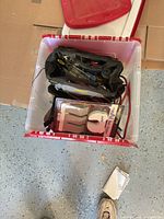 Top view of tote showing tool bag, jumper cables, packaged hooks