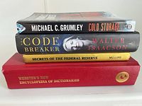 Stack showing book spines for title confirmation and condition
