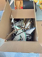 Open box showing assorted hangers of various materials