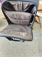 Open suitcase showing interior compartments and lining