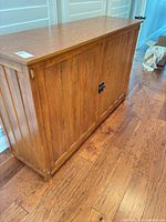 Front and side view showing slat panels, hardware, finish