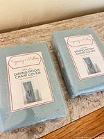Two sealed Spring Medley damask dining room chair covers light blue