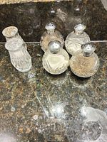 Five shakers on countertop, overall view