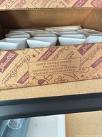 Top view of boxed white ceramic divided dishes