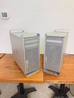 Front view of both Mac Pro towers on table