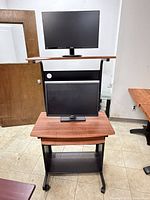 Rolling computer cart with both monitors mounted