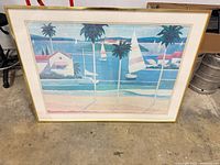 Front view of framed coastal sailboat print showing full artwork, frame and mat