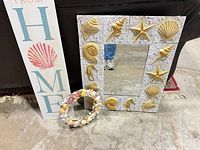 Overall view of mirror, sign and wreath