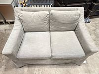 Front view showing overall loveseat, cushions, slipcover