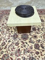 Top view showing square stone surface and pedestal center