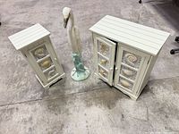 All three items: both cabinets and heron statue