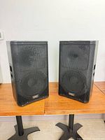 Front view of both QSC KW Series speakers on stands