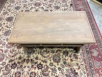 Top view of rectangular light brown solid wood coffee table