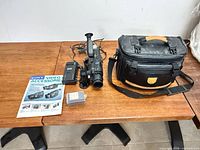 Full view of camcorder with all accessories on table