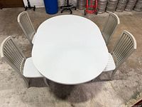 Top view of oval extendable table with four chairs