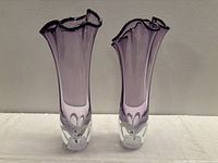 Full view of both matching purple art glass vases