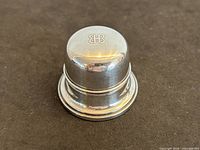 Closed Birks sterling round ring box, monogram visible