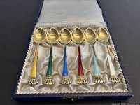 Set of six gilt sterling enamel spoons in case