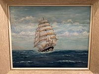 Full view of framed oil painting showing sailing ship scene