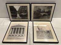 All four framed black-and-white photographs displayed together