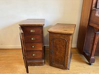 Both burl wood chests side by side