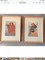 Both framed woodblock prints side by side