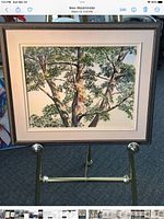Full view of framed watercolor on easel