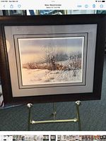 Full view of framed, triple-matted print on easel
