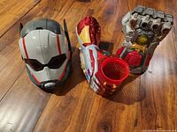 Group shot showing Ant-Man popcorn bucket, Iron Man drink holder, Thanos gauntlet