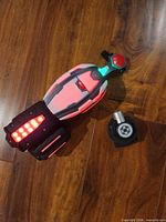 Top view of wrist shooter showing LED lights and web canister