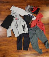 Group shot of all clothing items spread on floor