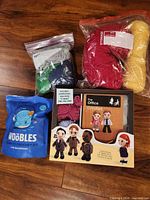 Overview of both crochet kits and five yarn skeins