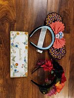 All three items laid out: Coco Mickey ear headband, floral headband, Remember Me tray
