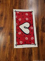 Red mat with heart and swirl pattern