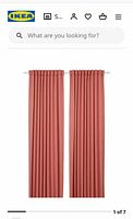 Stock image of two peach Majgull curtains hanging