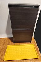 front view of espresso shoe cabinet with yellow boot tray